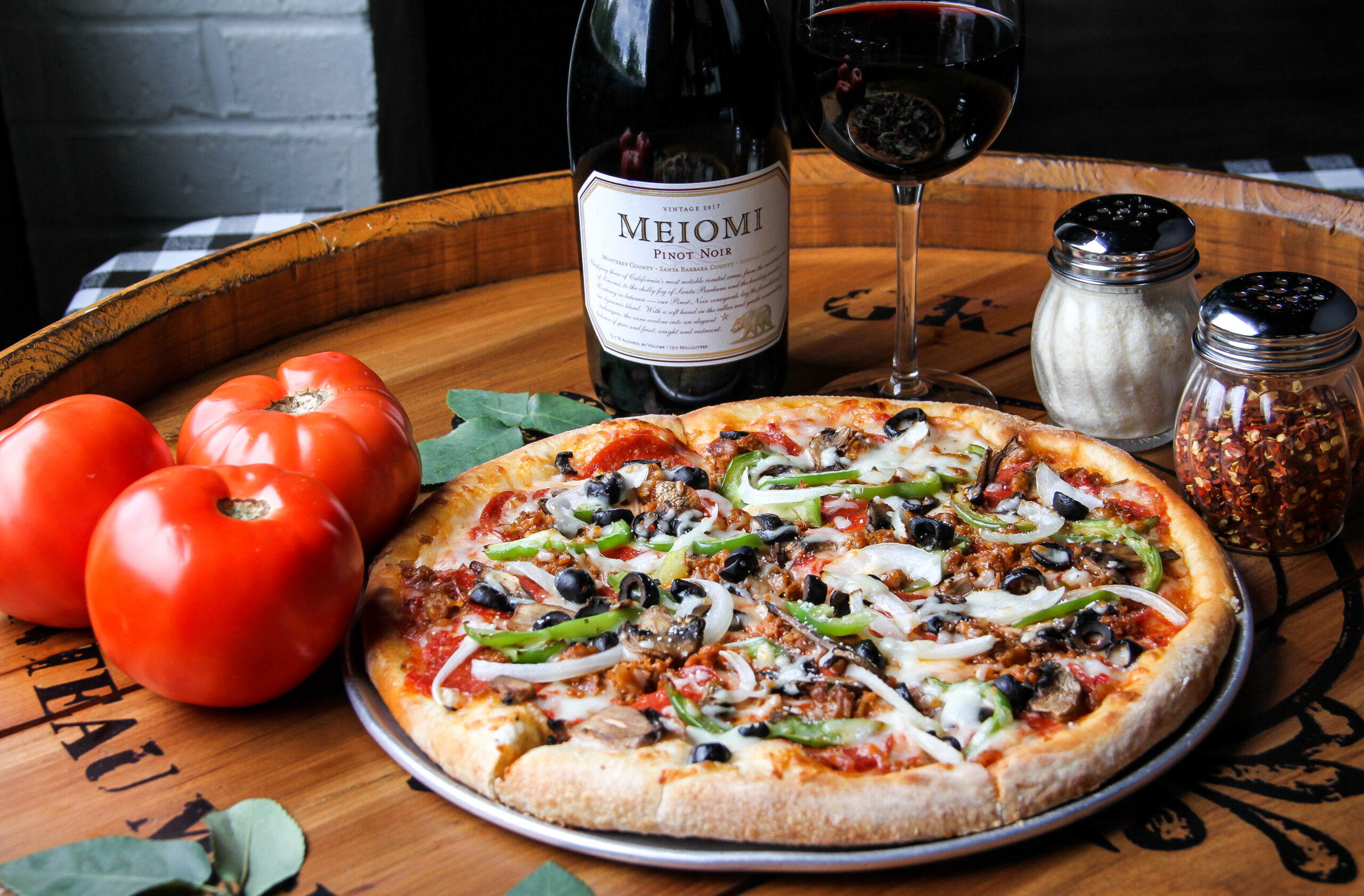 Traditional Italian pizza and wine at Ippolito’s Italian of Suwanee